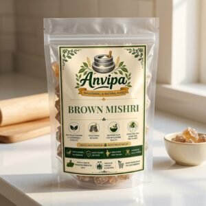 A premium pouch of Anvipa chemical-free Natural Brown Mishri alongside a bowl of unrefined raw amber rock sugar crystals, showing khandsari mishri.