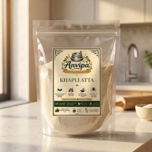 Anvipa ancient Khapli Atta package displayed with whole Emmer wheat grains, showcasing unadulterated cold stone ground flour for gentle digestion.
