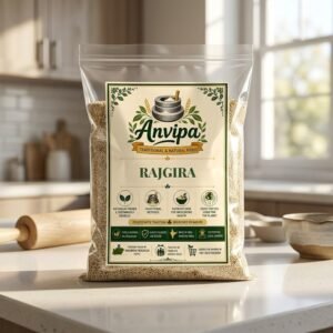 A premium pouch of Anvipa chemical-free Pure Rajgira Seeds beside a small wooden scoop showing clean, raw cream-colored amaranth grains.