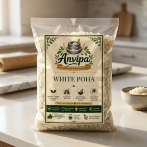 A premium pouch of Anvipa chemical-free Pure White Poha beside a small wooden bowl filled with dry, thick, and rustic off-white flattened rice flakes.