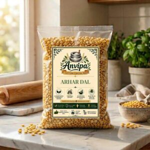 A premium pouch of Anvipa chemical-free Pure Toor Dal beside a small bowl showing clean, raw, and unpolished yellow split pigeon peas.