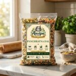 A premium pouch of Anvipa chemical-free Pure Panchratna Dal beside a small bowl showing clean, raw, unpolished 5-grain split pulse mix.