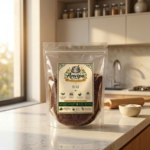 A premium pouch of Anvipa chemical-free Pure Rai Seeds Mustard beside a small terracotta bowl filled with raw, tiny reddish-brown chhoti rai seeds.